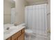 A full bathroom with a tub/shower combo with shower curtain, vanity, toilet, and mirror at 331 Wilkes Place Dr, Fort Mill, SC 29715