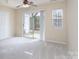 Bright bedroom featuring a sliding glass door to the outdoors and a convenient closet at 331 Wilkes Place Dr, Fort Mill, SC 29715