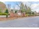 Community sign for The Townes at River Crossing with landscaping at 331 Wilkes Place Dr, Fort Mill, SC 29715