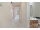 Neutral hallway leading to a bathroom and a view of the backyard at 331 Wilkes Place Dr, Fort Mill, SC 29715