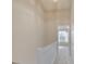 Well-lit upper hallway with neutral carpeting and a view into a bedroom at 331 Wilkes Place Dr, Fort Mill, SC 29715