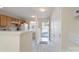 Bright kitchen features ample cabinet space, a breakfast bar, and an open entryway at 331 Wilkes Place Dr, Fort Mill, SC 29715