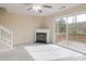 Bright living room showcasing a fireplace, deck access, and plush carpeting at 331 Wilkes Place Dr, Fort Mill, SC 29715