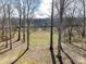 A treed backyard and beautiful lawn in a great setting at 4130 Waterway Dr, Monroe, NC 28110