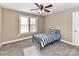 Bedroom with neutral carpet, ceiling fan, and a window providing natural light at 4130 Waterway Dr, Monroe, NC 28110