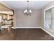 Elegant dining area with hardwood floors, pendant lighting, with kitchen view for easy serving, great for gatherings at 4130 Waterway Dr, Monroe, NC 28110