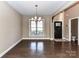 Classic dining room features hardwood floors, elegant chandelier, and a nearby powder room for convenience at 4130 Waterway Dr, Monroe, NC 28110