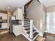Inviting entryway with hardwood floors, staircase, and view to the kitchen area at 4130 Waterway Dr, Monroe, NC 28110