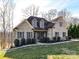 Charming, light brick home boasts meticulous landscaping, inviting curb appeal, and a serene neighborhood setting at 4130 Waterway Dr, Monroe, NC 28110