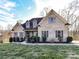 Well-maintained brick home with classic shutters, manicured bushes and lawn, and a charming front entrance at 4130 Waterway Dr, Monroe, NC 28110