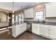 Bright kitchen offers a view to the dining room with stainless appliances and granite counters at 4130 Waterway Dr, Monroe, NC 28110