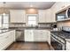 Modern kitchen features stainless steel appliances and ample counter space, perfect for cooking at 4130 Waterway Dr, Monroe, NC 28110