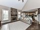 Open-concept living room with a stone fireplace, seamlessly connecting to the kitchen area at 4130 Waterway Dr, Monroe, NC 28110