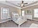 Comfortable main bedroom features a tray ceiling, carpeted floors, and natural light at 4130 Waterway Dr, Monroe, NC 28110