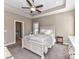 Relaxing main bedroom suite features a tray ceiling and a view to the bathroom at 4130 Waterway Dr, Monroe, NC 28110