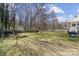 Expansive backyard with an outbuilding, play set and a fire pit at 5902 Mt Holly Huntersville Rd, Charlotte, NC 28216