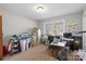 Bedroom featuring an office space with a large window providing plenty of natural light at 5902 Mt Holly Huntersville Rd, Charlotte, NC 28216