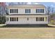 Inviting two-story house featuring a spacious front porch and well-kept lawn at 5902 Mt Holly Huntersville Rd, Charlotte, NC 28216