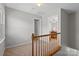 Upstairs hallway leading to a bedroom at 5902 Mt Holly Huntersville Rd, Charlotte, NC 28216