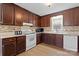 Functional kitchen with wood cabinets, ample countertop space, and modern appliances at 5902 Mt Holly Huntersville Rd, Charlotte, NC 28216