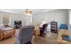 Comfortable living room featuring hardwood floors, neutral tones, and plenty of seating at 5902 Mt Holly Huntersville Rd, Charlotte, NC 28216