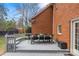Back deck featuring an outdoor dining area perfect for relaxing and entertaining at 700 Queen Charlottes Ct, Charlotte, NC 28211