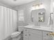 Bathroom featuring a modern vanity, sleek mirror, and tile flooring at 700 Queen Charlottes Ct, Charlotte, NC 28211