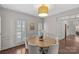 Dining room featuring a round table with comfortable seating and stylish decor at 700 Queen Charlottes Ct, Charlotte, NC 28211