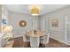 Cozy dining room featuring a round table with comfortable seating and stylish decor at 700 Queen Charlottes Ct, Charlotte, NC 28211