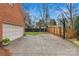 The driveway features a basketball hoop and a private fenced-in backyard at 700 Queen Charlottes Ct, Charlotte, NC 28211