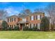 Lovely brick home featuring a well-maintained lawn and meticulous landscaping in a serene neighborhood at 700 Queen Charlottes Ct, Charlotte, NC 28211