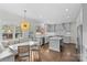 Bright kitchen with island, dining nook, and high-end finishes at 700 Queen Charlottes Ct, Charlotte, NC 28211