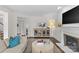 Living room boasting fireplace, display cabinet, and comfortable seating at 700 Queen Charlottes Ct, Charlotte, NC 28211