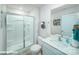 Well-lit bathroom featuring a glass-enclosed shower and a modern vanity at 8043 Plymouth Rd, Sherrills Ford, NC 28673