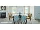 Formal dining room with hardwood floors, large window with bright natural light and a decorative fireplace at 8043 Plymouth Rd, Sherrills Ford, NC 28673