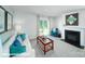Bright and cozy living room featuring a fireplace, modern decor, and sliding glass doors to the outside at 8043 Plymouth Rd, Sherrills Ford, NC 28673