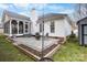 Spacious backyard with a patio, fire pit, screened porch, and storage shed, offering ample outdoor space at 8211 Poplar Grove Cir # 31, Waxhaw, NC 28173
