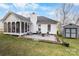 Beautiful backyard featuring a patio, fire pit, and screened-in porch, ideal for outdoor entertaining and relaxation at 8211 Poplar Grove Cir # 31, Waxhaw, NC 28173