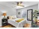 Cozy bedroom with a ceiling fan, bright window, and comfortable bed, creating a relaxing atmosphere at 8211 Poplar Grove Cir # 31, Waxhaw, NC 28173