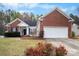 Charming brick home with a well-manicured lawn and inviting front entrance at 8211 Poplar Grove Cir # 31, Waxhaw, NC 28173