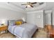 Inviting main bedroom featuring a tray ceiling, ceiling fan, and neutral decor at 8211 Poplar Grove Cir # 31, Waxhaw, NC 28173