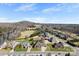 Aerial view of neighborhood showcasing homes with large lots, mature trees, and well-manicured lawns at 9016 Heather Trce, Gastonia, NC 28056