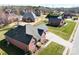 Aerial view of neighborhood showcasing homes with large lots, mature trees, and well-manicured lawns at 9016 Heather Trce, Gastonia, NC 28056