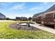 Spacious backyard features a paved patio and a fire pit, ideal for outdoor entertaining at 9016 Heather Trce, Gastonia, NC 28056