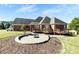 Spacious backyard features a paved patio and a fire pit, ideal for outdoor entertaining at 9016 Heather Trce, Gastonia, NC 28056
