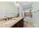 Bathroom with granite countertop, double sinks, and a bathtub at 9016 Heather Trce, Gastonia, NC 28056