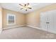 Comfortable carpeted bedroom with a ceiling fan and double door closet at 9016 Heather Trce, Gastonia, NC 28056
