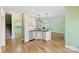 An open kitchen with granite countertops, stainless steel appliances, and hardwood flooring at 9016 Heather Trce, Gastonia, NC 28056