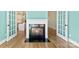 Living room featuring a fireplace and access to other rooms through double doors at 9016 Heather Trce, Gastonia, NC 28056