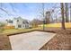 The backyard includes a basketball court and a well-maintained wooden fence at 10211 Ridgewell Ct, Charlotte, NC 28215
